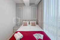 Combined Grey Toned 2BR Apartment at The City Square Surabaya By Travelio