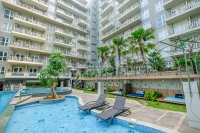Apartemen Grande Valore Condominium - Wonderful and Pool View 1BR Apartment Grande Valore Condominium By Travelio
