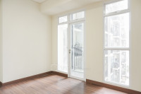 Homey Studio Unfurnished at 10th Floor Puri Orchard Apartment By Travelio