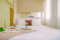 Bright 1BR with City View at Oasis Cikarang Apartment by Travelio