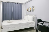 Minimalist Studio at Grand Asia Afrika Apartment By Travelio