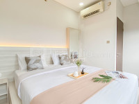 Modern Look 2BR Corner Transpark Cibubur Apartment By Travelio