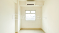Warm 2BR Unfurnished with AC at Green Pramuka City Apartment By Travelio