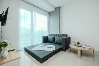 2BR with Sofa bed & Service Room Apartment Woodland Park Residence By Travelio