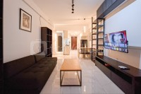 Monochromatic 2BR with Extra Working Room Apartment Sky House BSD By Travelio