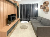 Wooden Accents 1BR at Podomoro City Deli Medan Apartment By Travelio