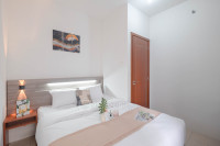 Minimalist and Well Designed 2BR Apartment with Extra Room at Vittoria Residence By Travelio