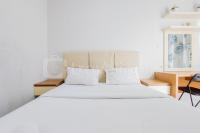 Homey and Elegant Studio Amazana Serpong Apartment By Travelio