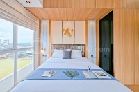 Wooden Tone Studio at Casa de Parco Apartment By Travelio