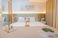 Warm Minimalist Studio Room at Tokyo Riverside PIK 2 Apartment By Travelio