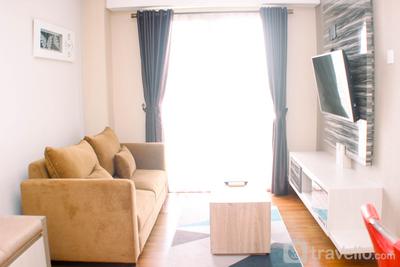 Fully Furnished 1BR with Working Room at Trivium Terrace Apartment By Travelio