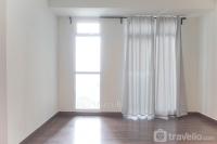 Unfurnished Studio with AC at 15th Floor Puri Orchard Apartment By Travelio