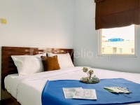 Warm 2BR at Pluit Sea View Apartment By Travelio