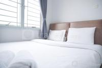 Modern and Homey 2BR at City Park Apartment By Travelio