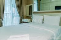 Homey and Warm Studio Room at Tifolia Apartment By Travelio