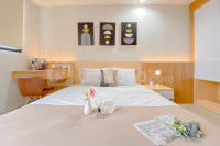 Cozy Living Studio at Evenciio Margonda Apartment By Travelio