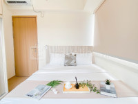 Spacious 3BR with Neutral Toned at Meikarta Apartment By Travelio