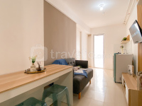 Comfy Warm Tone 1BR at Apartment Bassura City By Travelio