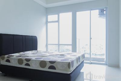 Strategic Unfurnished Studio with AC at 11th Floor Puri Mansion Apartment By Travelio