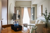 Homey Scandinavian 2BR at Tamansari Panoramic Apartment By Travelio