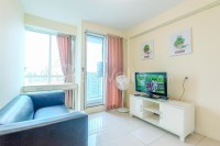 Homey and Comfortable 2BR Tifolia Apartment By Travelio