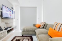 Comfort 2BR at Skylounge Tamansari Apartment By Travelio
