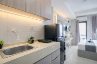 Apartemen Monroe Tower - Wooden Accents Studio at Monroe Tower Apartment By Travelio