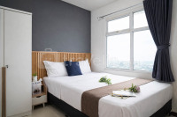 Restful 2BR with Sea View at Apartment Green Bay Condominium By Travelio