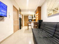 Homey and Minimalist 1BR Tamansari Iswara Apartment By Travelio