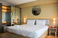 Homey and Cozy Living Studio at Tamansari The Hive Apartment By Travelio