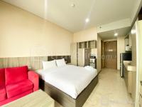 Homey and Tidy Studio Grande Valore Condominium Apartment By Travelio