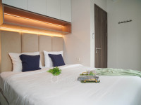 Warm Wooden Touch 2BR at Apartment Emerald Bintaro By Travelio