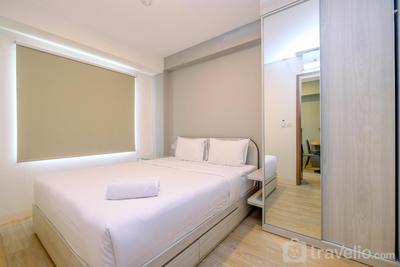 Minimalist and Warm 2BR at 29th Floor Podomoro Golf View Apartment By Travelio