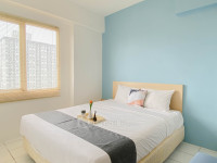 Cozy with Blue Accent 2BR at Podomoro Golf View Apartment By Travelio