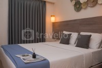 Elegant and Strategic 2BR Apartment at Sky House BSD By Travelio